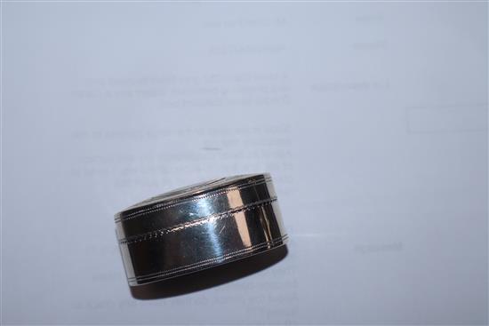 A George III engraved silver oval nutmeg grater by Joseph Wilmore, Birmingham, 1800, (grille hinge damaged), 46mm.